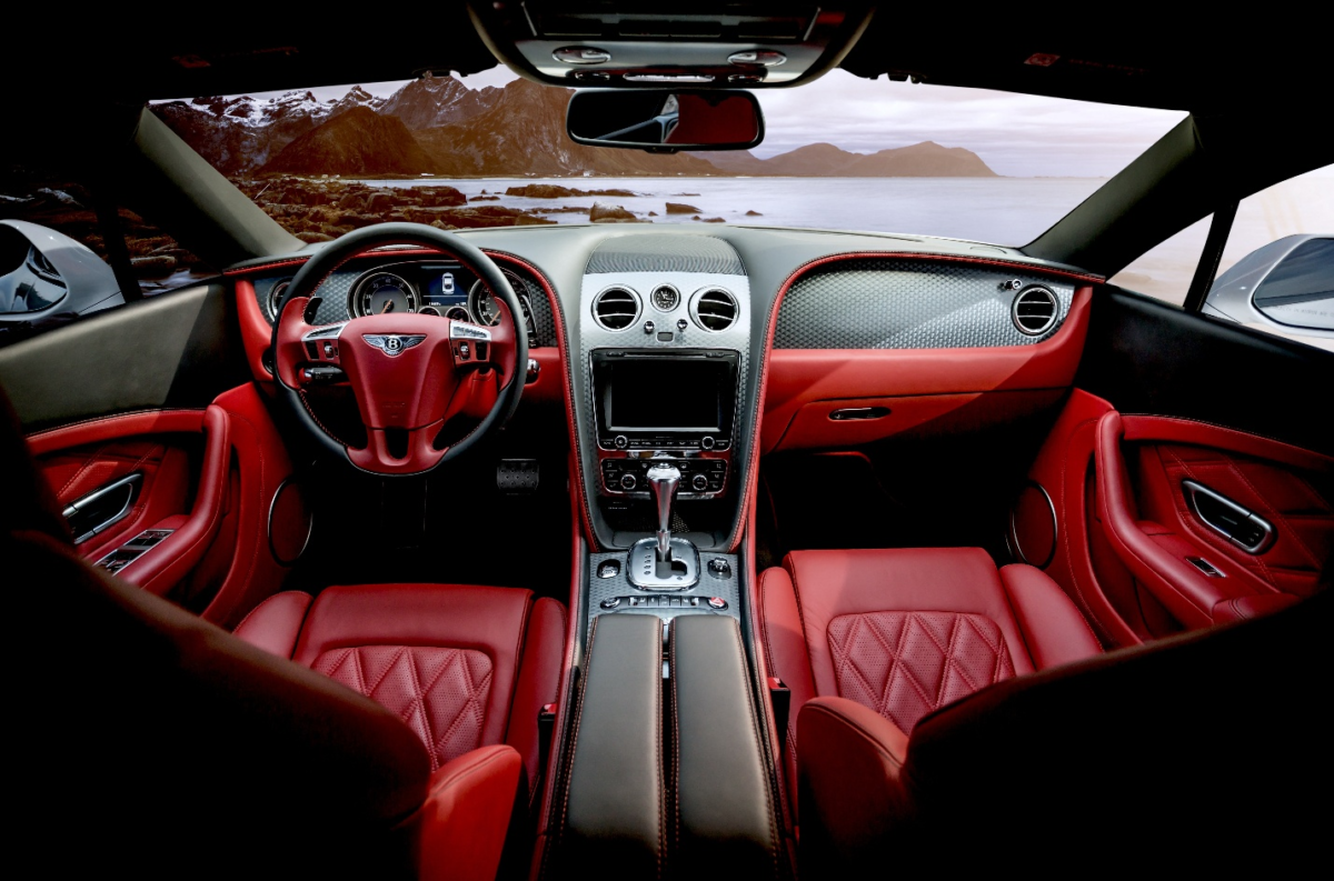 The interior of a luxury car in red color