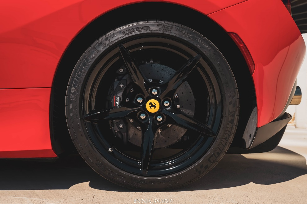 Close-up shot of the wheel of a Ferrari F8 Spider