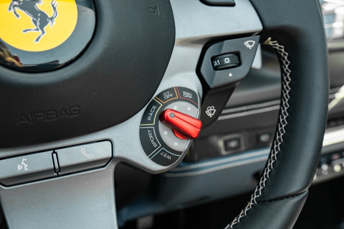 Close-up shot of a Ferrari steering wheel