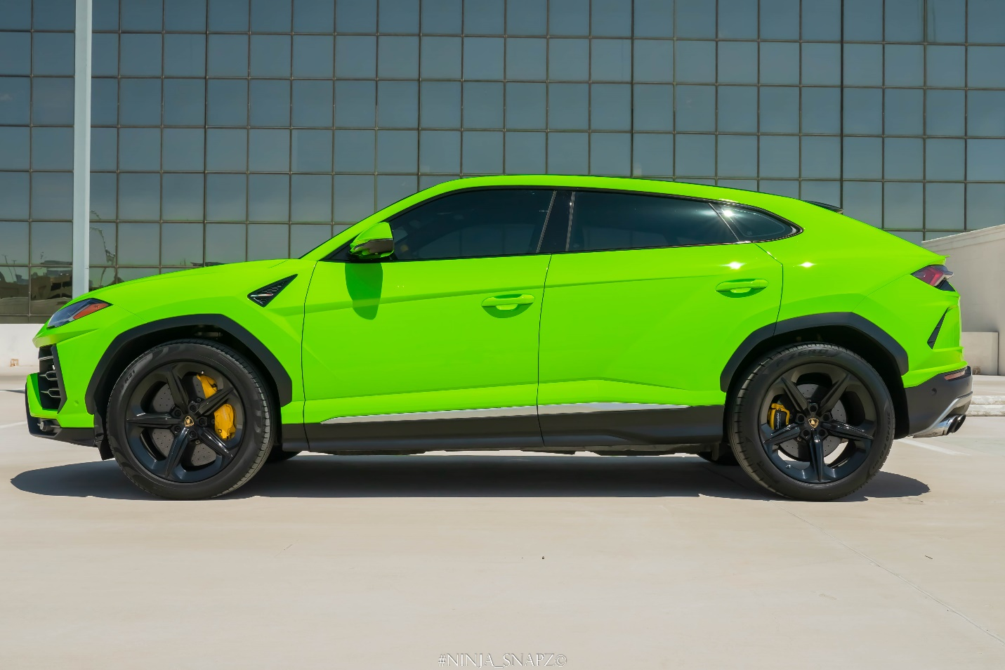 A green Lamborghini urus