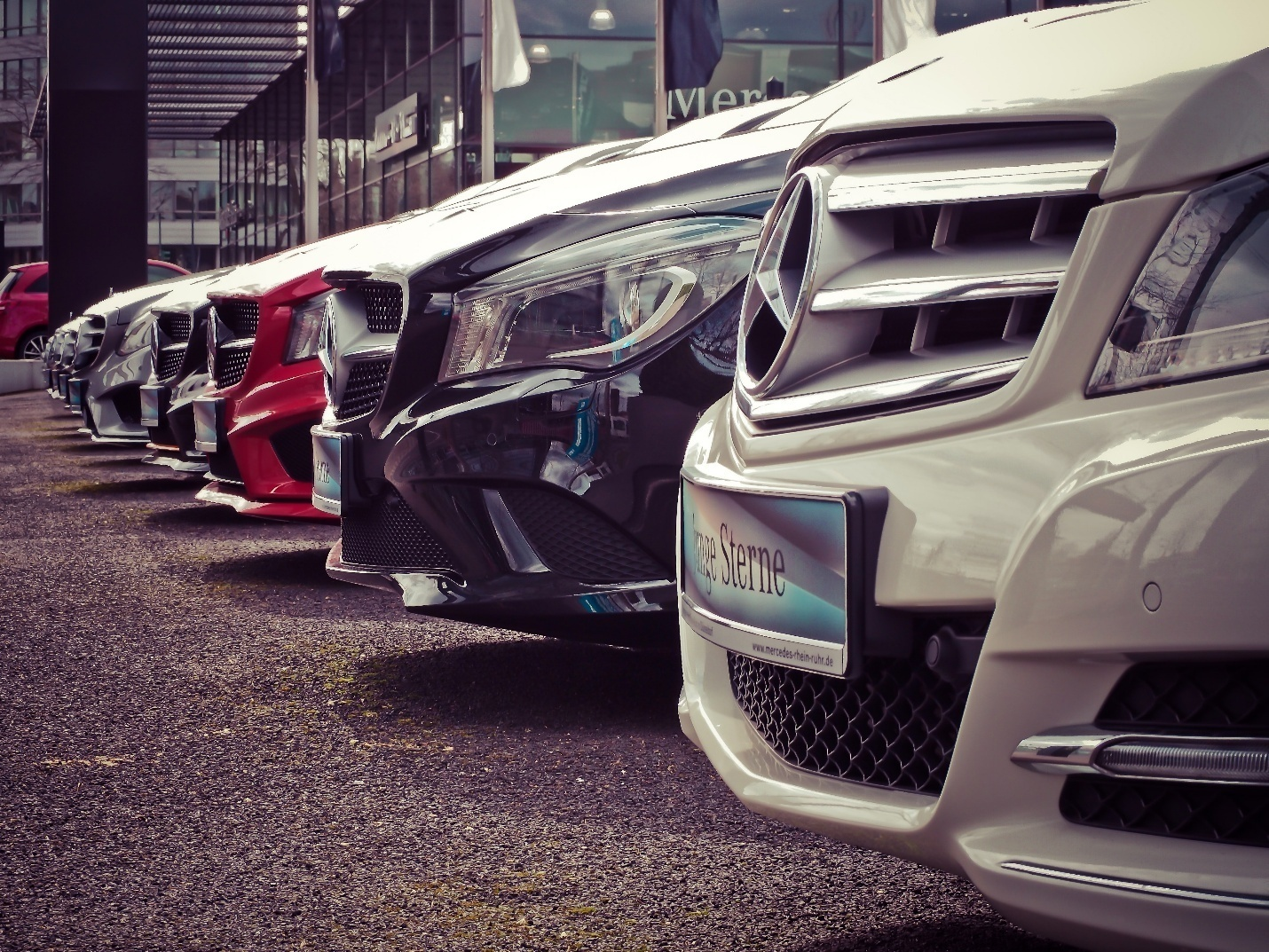 Several Mercedes Bens parked together