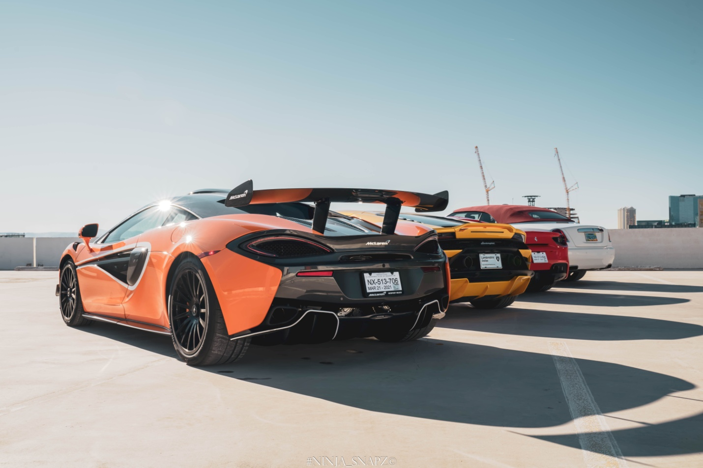 Close up picture of fours supercars parked