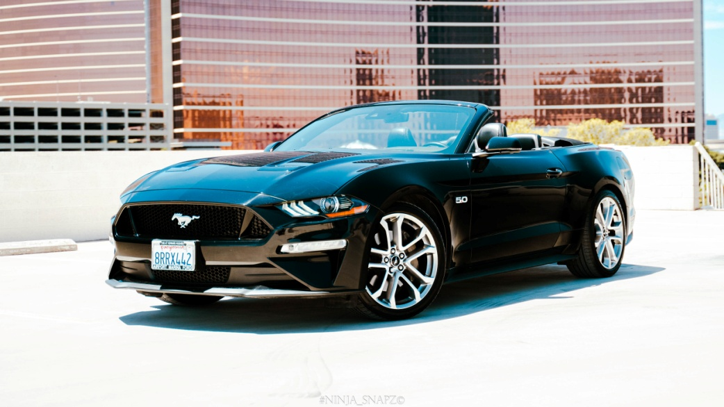 A black Ford Mustang convertible