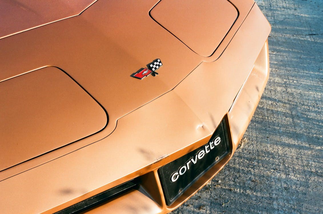 logo on an orange Chevrolet Corvette